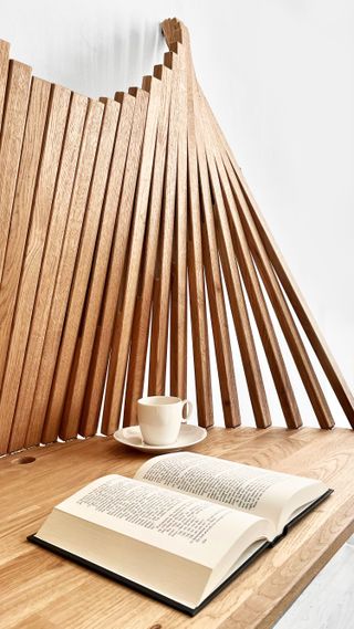 wooden desk with coffee mug and open book