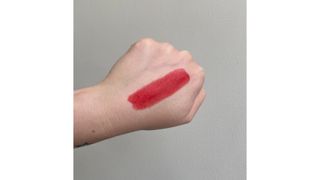 Swatch of Clarins Joli Rouge Lipstick in Cherry Red