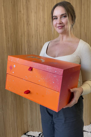 valeza holding the sephora beauty advent calendar - a big orange box