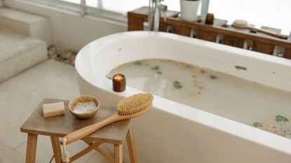 Bathtub with brush and candle