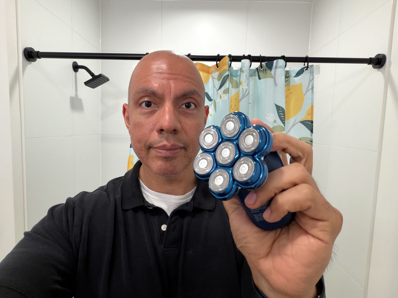 Dollar Shave Club Head Shaver held in hand