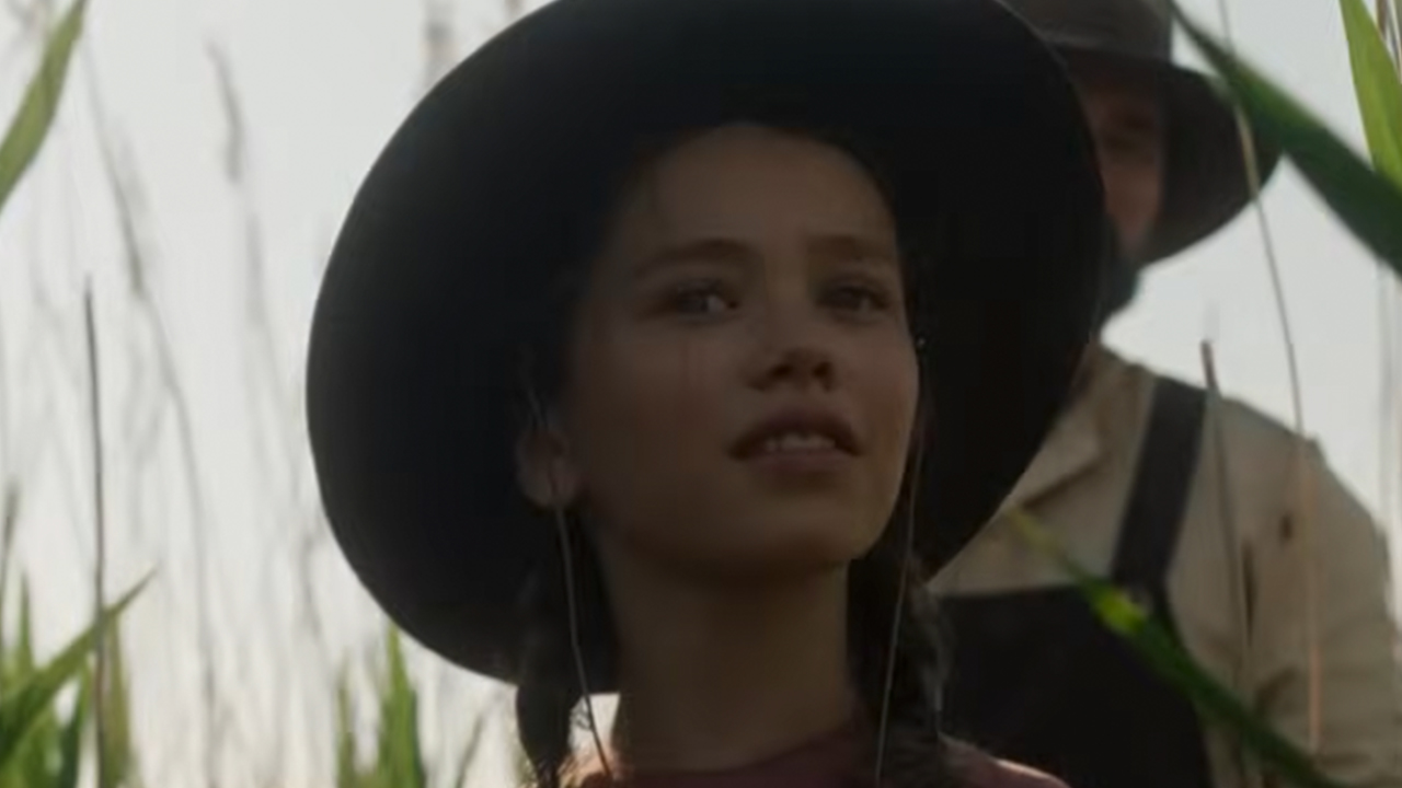 A close-up of Alice Halsey wearing a hat in Little House on the Prairie