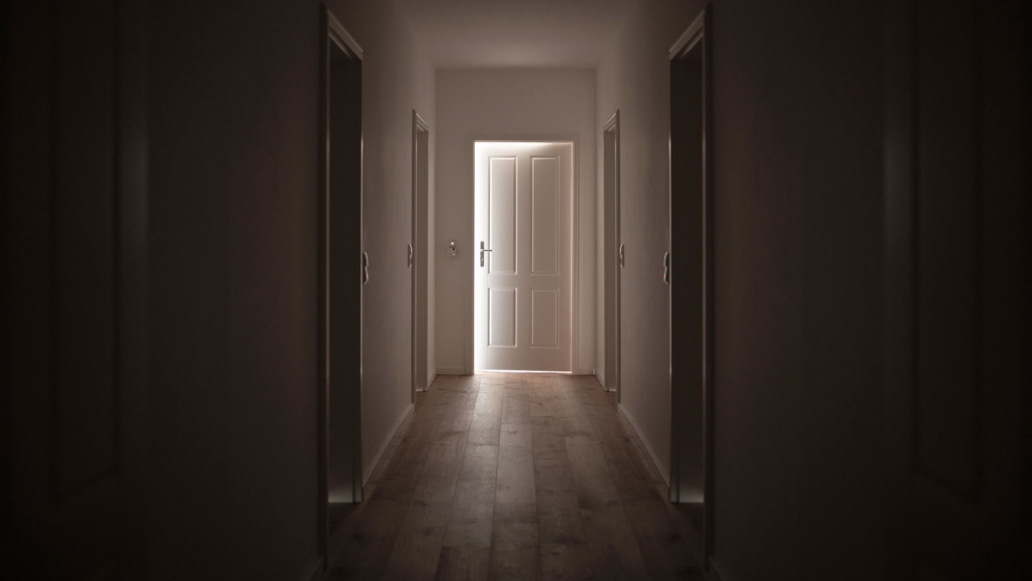 Door at the end of a corridor