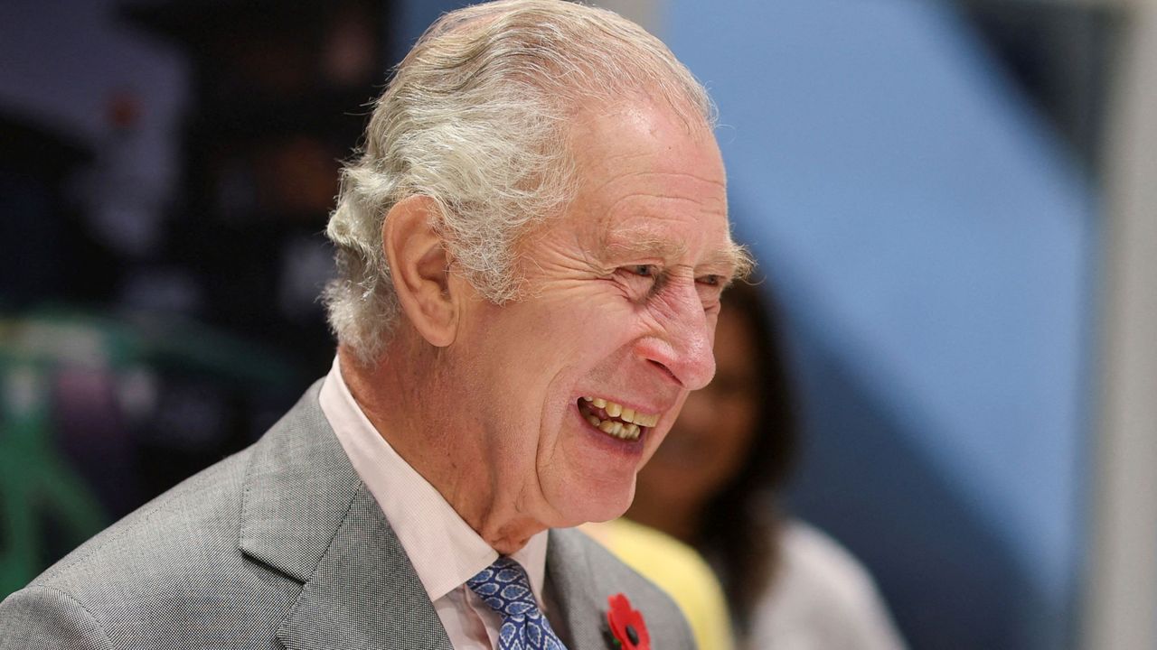 Britain&#039;s King Charles III laughs during to Morrisons Supermarkets headquarters in Bradford on November 8, 2022 during a two-day tour of Yorkshire. 