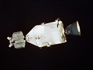 The American Apollo spacecraft as seen in Earth orbit from the Soviet Soyuz spacecraft. Note the special docking module attached to the Apollo capsule, specifically designed to allow the two spacecraft to join in orbit.