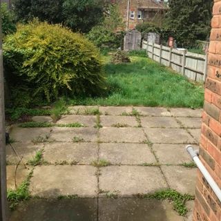 garden patio with weeds