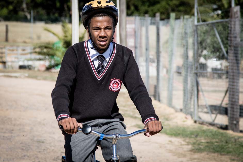 One of the recipients takes a ride on his new bike