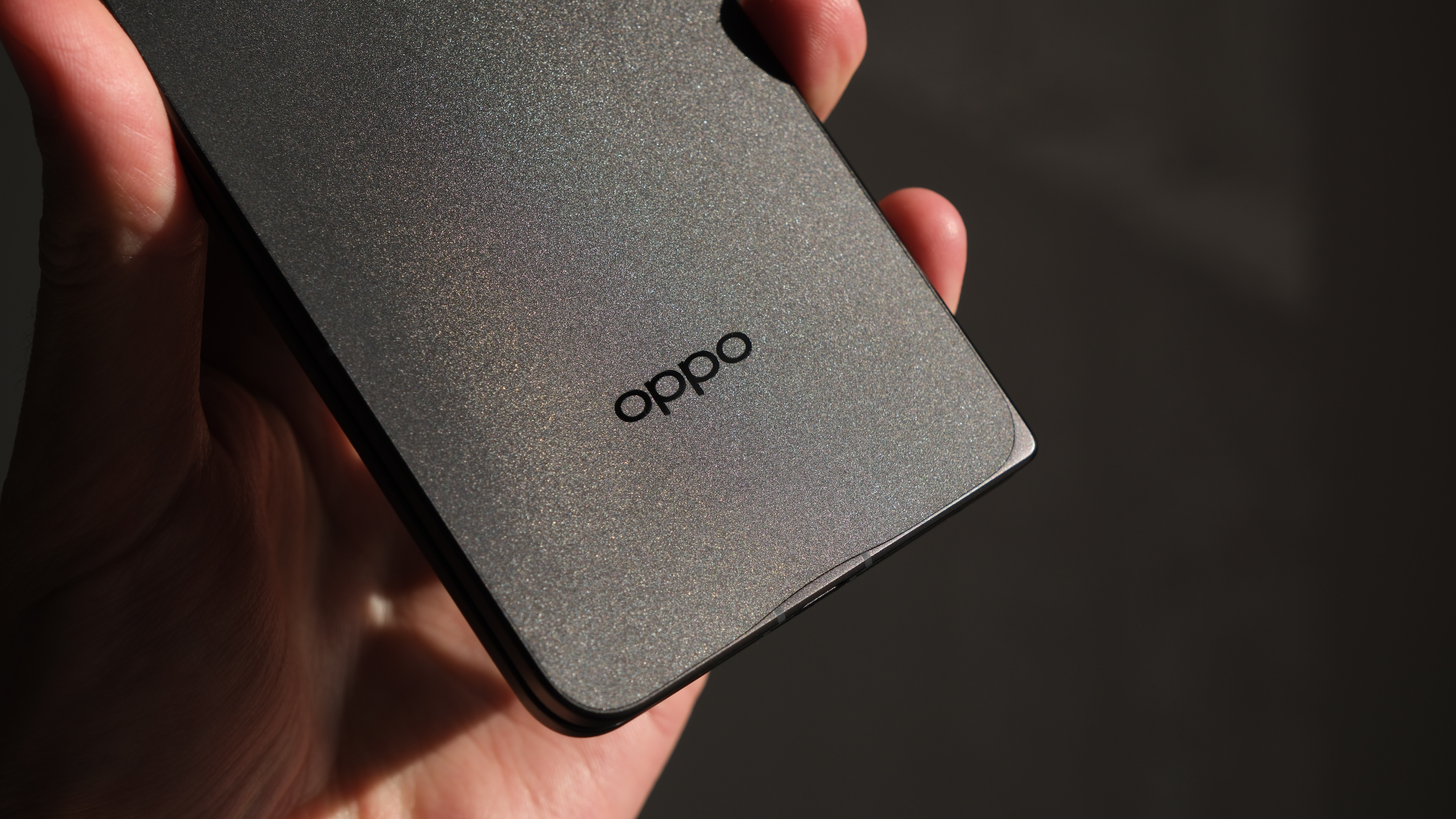 Close up of the Oppo logo on the Find N5 phone held in a hand