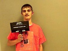 Man takes new jail mug shot with a T-shirt of his old mug shot