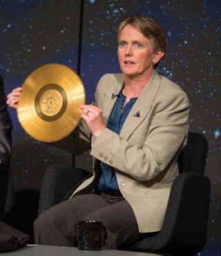 Suzanne Dodd, Voyager project manager, NASA's Jet Propulsion Lab (JPL) holds a replica of the golden record carried on Voyager at a news conference on NASA's Voyager 1 spacecraft, Thursday, Sept. 12, 2013 at NASA Headquarters in Washington.