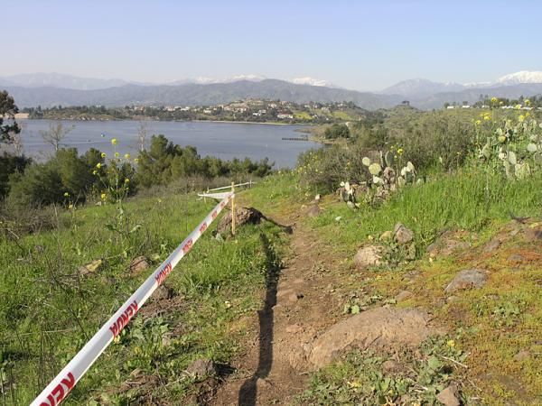 A singletrack climb on the back side of the cross country course. The snow-topped San Gabriel mountains are in the background.