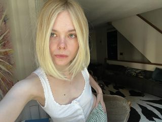 @ellefanning taking a selfie with a long, sliced bob hairstyle