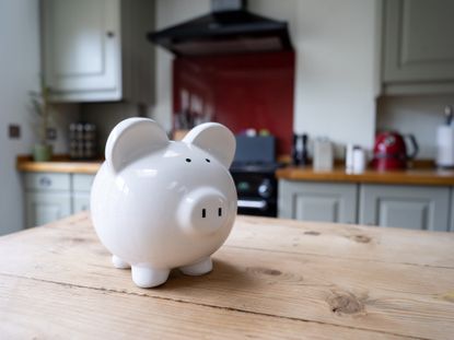 White piggy bank on a domestic kitchen counter