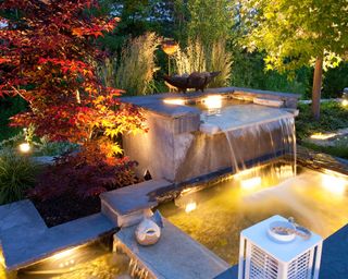 garden lighting with waterfall and pond