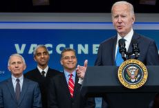 White House COVID advisers standing behind Biden.