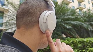 Bose QC Ultra Headphones worn by reviewer Alex Bracetti