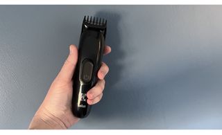 gillette beard trimmer held in hand