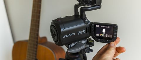 The Zoom Q8n-4K in front of a guitar