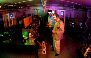 shooting laser beams at antimatter