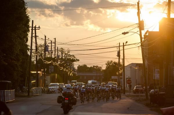 The women's peloton races into the sunset.