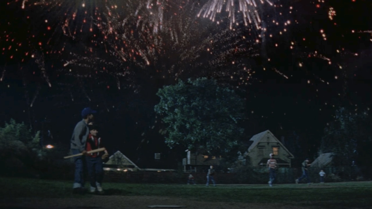 Fireworks going off as the kids play baseball at night in The Sandlot