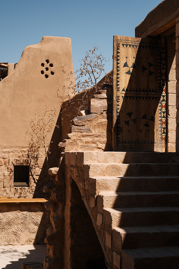 views of mud brick house with warm hues in desert building style, Bin Nouh's Courtyard House by Shahira Fahmy