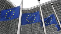 EU flags fly outside the union headquarters in Brussels, Belgium.