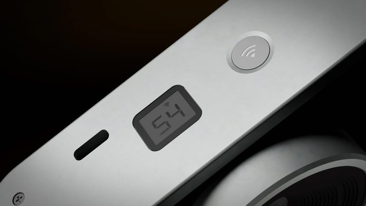A close-up product image of the Echolens retro compact camera on a dark background