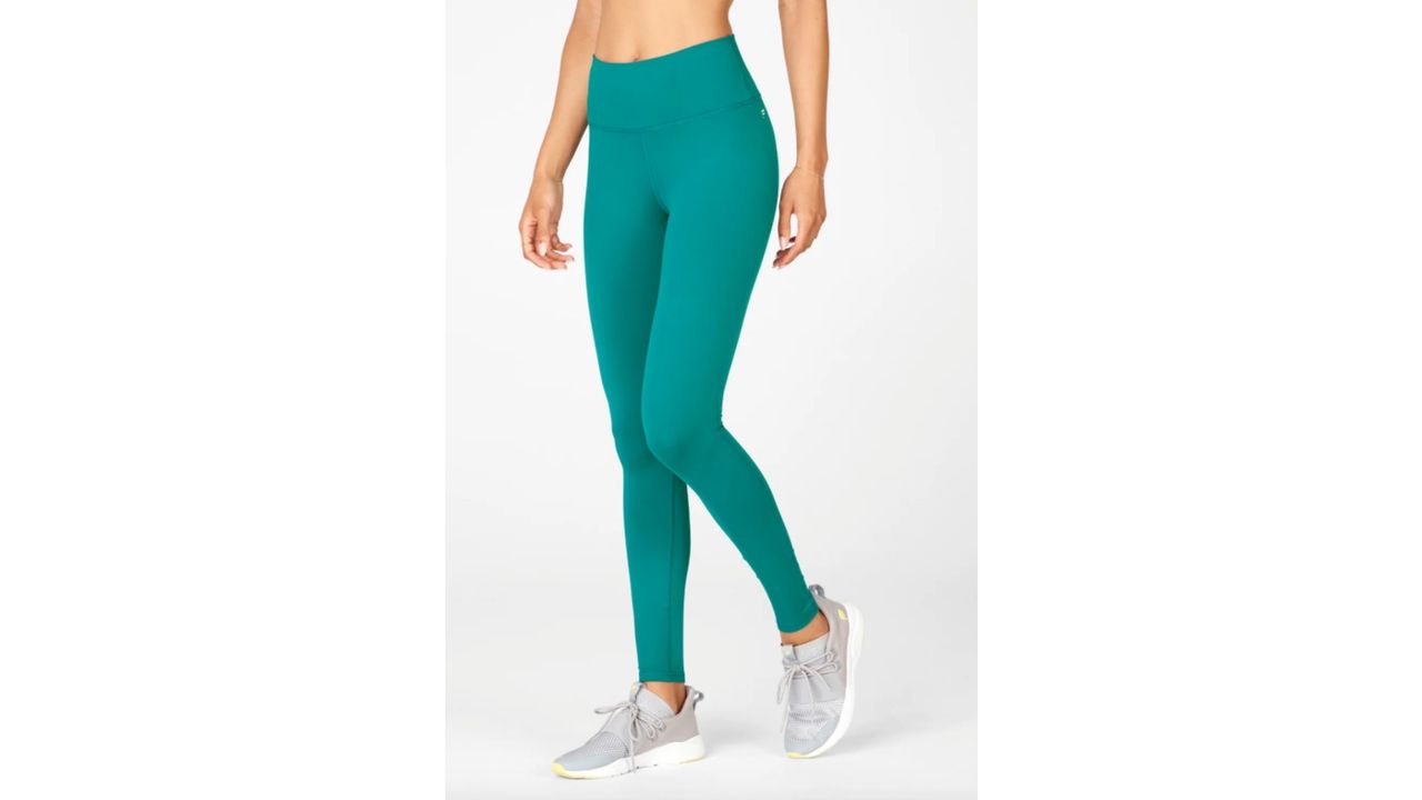 fabletics leggings review: model wearing Fabletics High-Waisted PowerHold Leggings