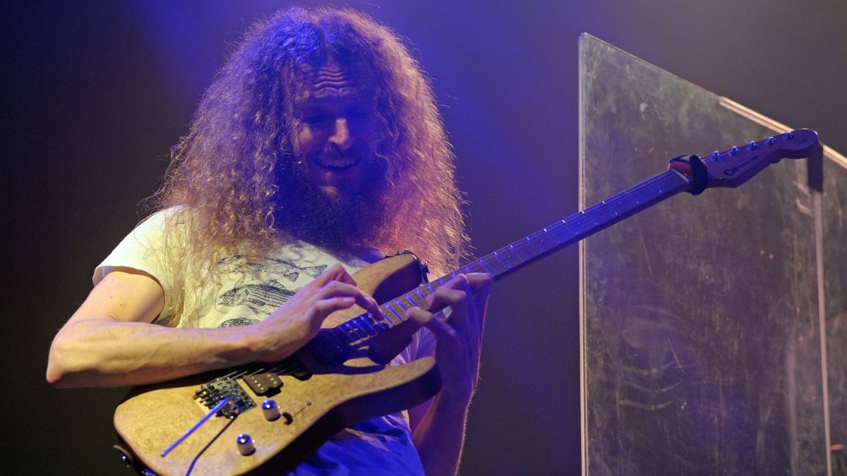 This photograph taken on August 11, 2014, shows guitarist Guthrie Govan of the band The Aristocrats performing in Hong Kong.