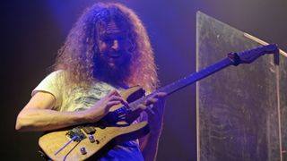 This photograph taken on August 11, 2014, shows guitarist Guthrie Govan of the band The Aristocrats performing in Hong Kong.