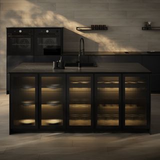 A dark kitchen with ribbed glass cabinet fronts