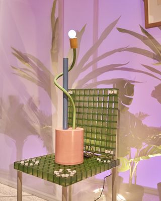 Lamp integrated into a green chair art piece named Sinerpica Angolosa by Michele De Lucchi, 1978