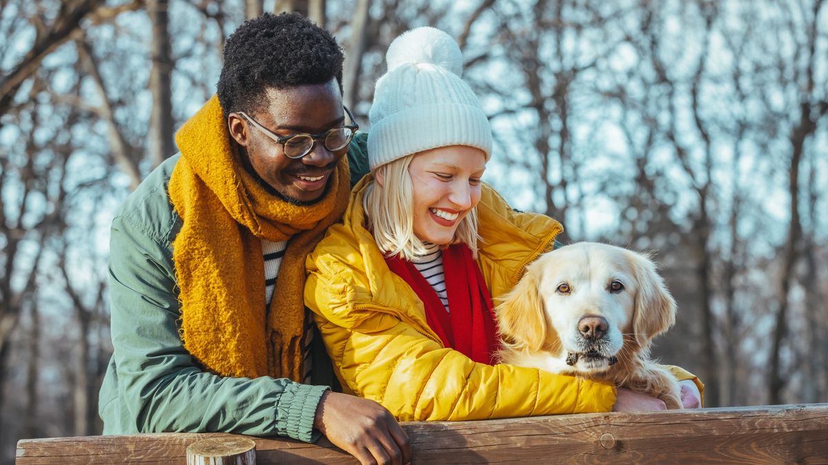 Couple in nature with their dog