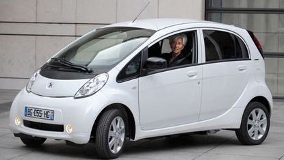 An electric car driven by Christine Lagarde 