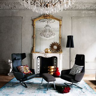 living room with ornate mirror and leather seating