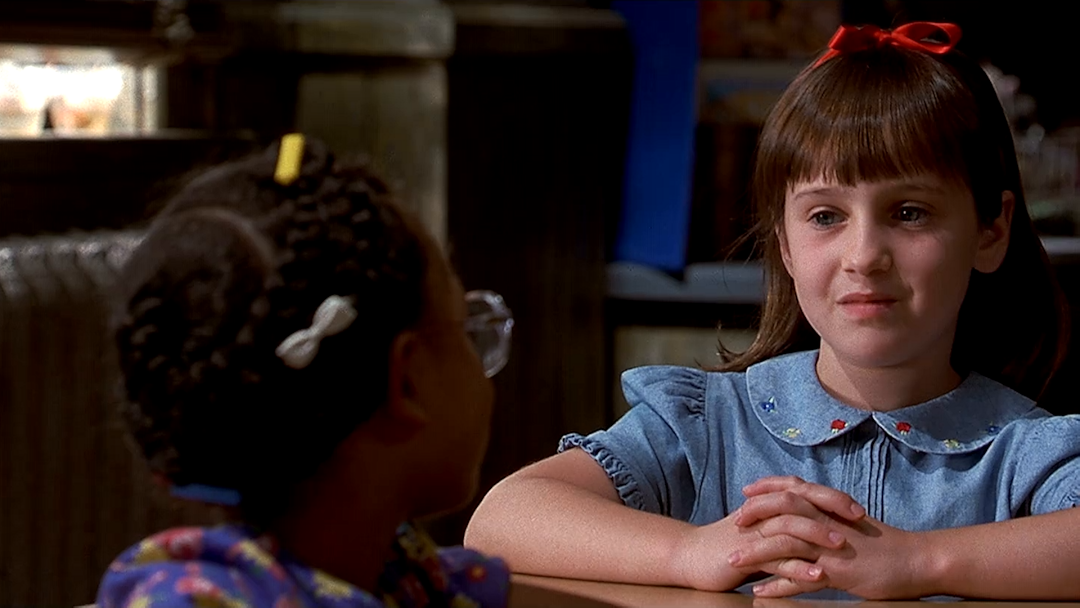 Matilda and Lavender sit at their school desks in the movie Matilda