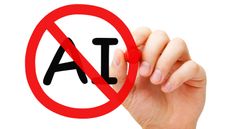 A man's draws a red circle with a slash over the initials AI.