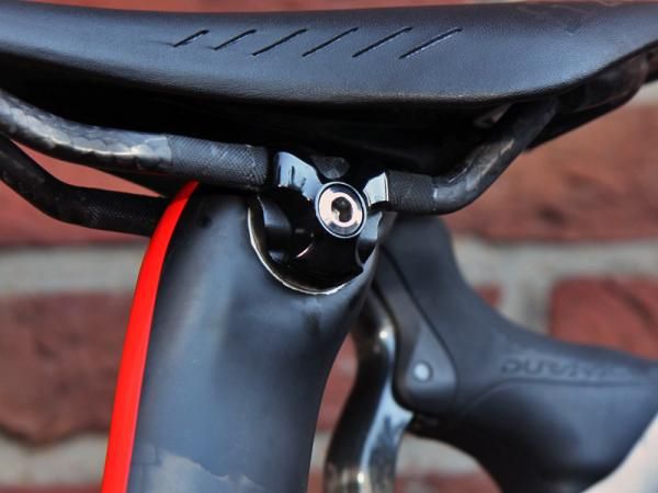 From the looks of things, Specialized makes different sets of seatpost head hardware to suit various saddle rail shapes.