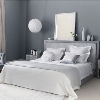 Grey bedroom with upholstered headboard