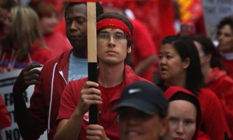 Striking Chicago public school teachers and their supporters rally before a march down Michigan Avenue on Sept. 13, 2012 in Chicago. The city&amp;#039;s teachers have vowed to continue striking for a 