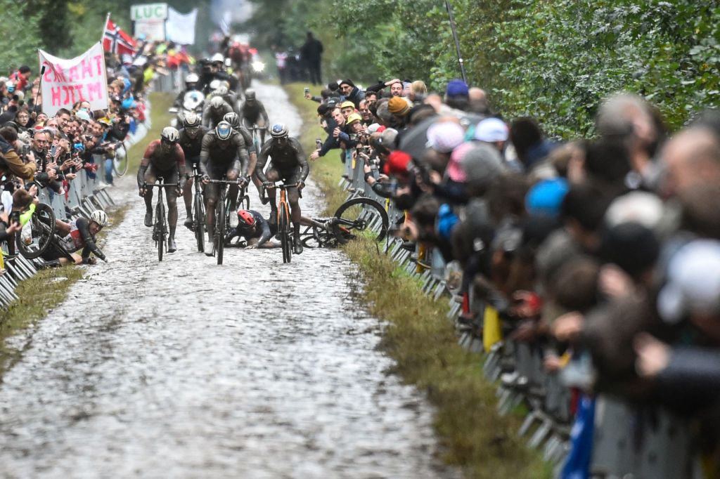 A competitors falls during the 118th edition of the ParisRoubaix oneday classic cycling race between Compiegne and Roubaix northern France on October 3 2021 Photo by FRANCOIS LO PRESTI AFP Photo by FRANCOIS LO PRESTIAFP via Getty Images