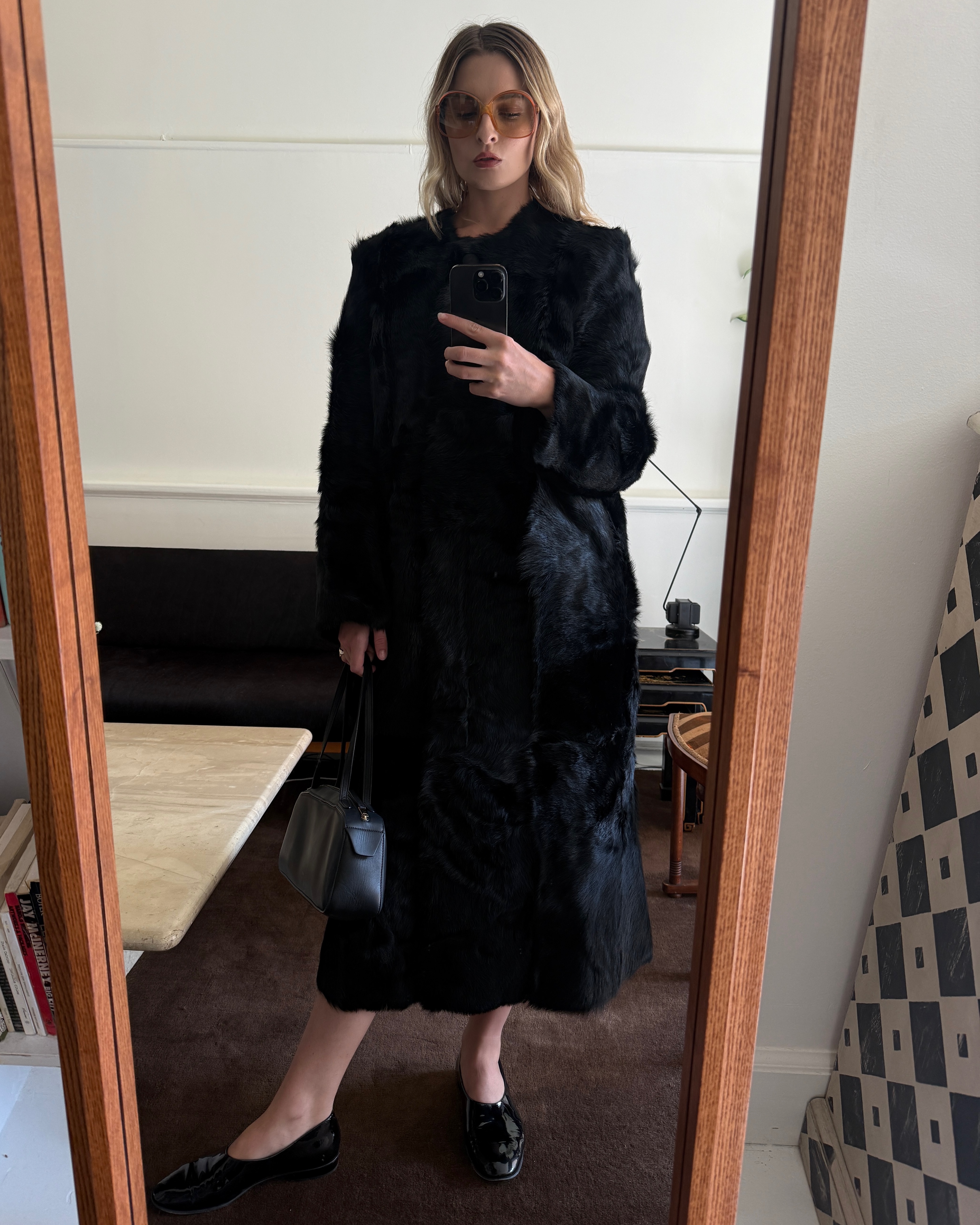 Christie Tyler styles a black pony hair coat.