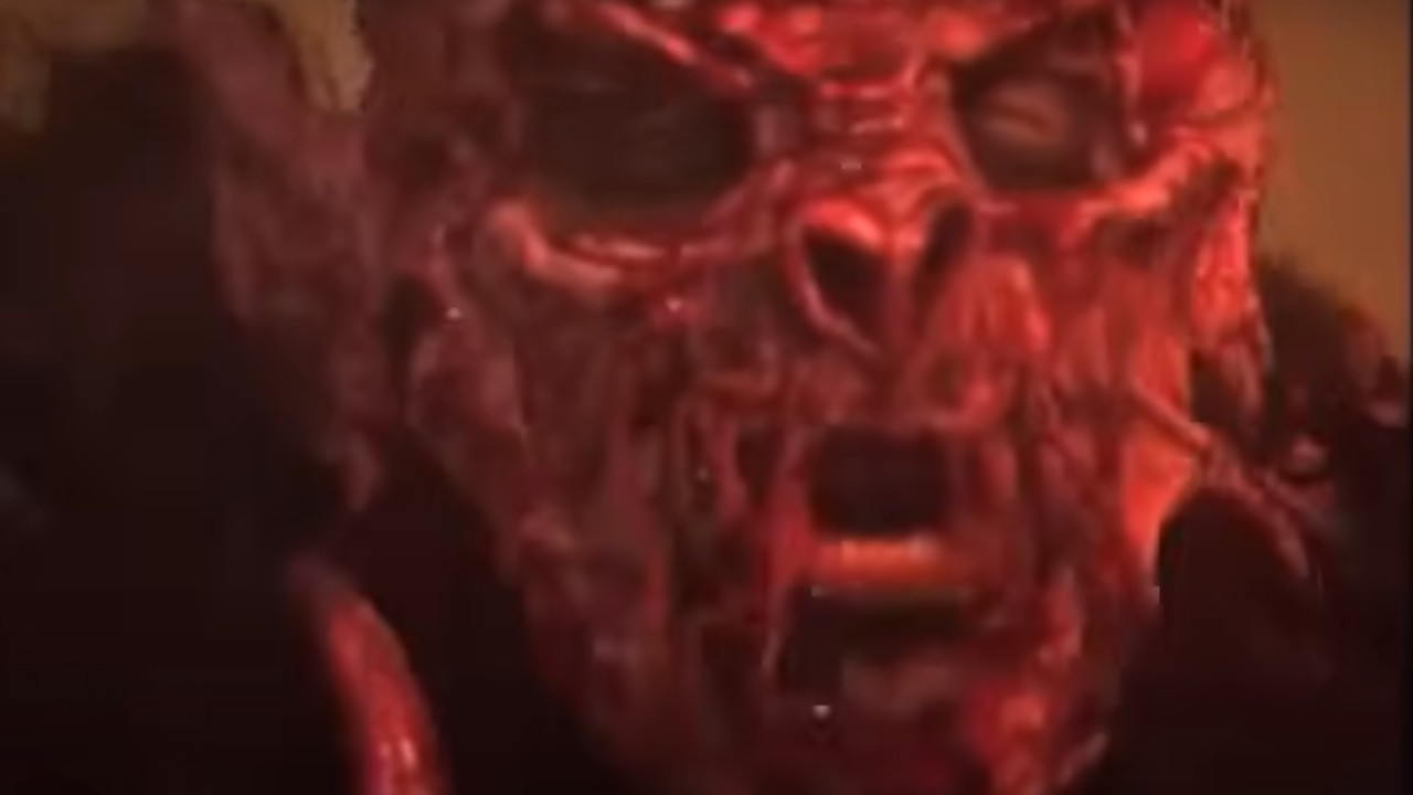 Dave Brockie wearing a mask for the song 