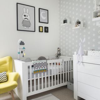 grey nursery with white cot