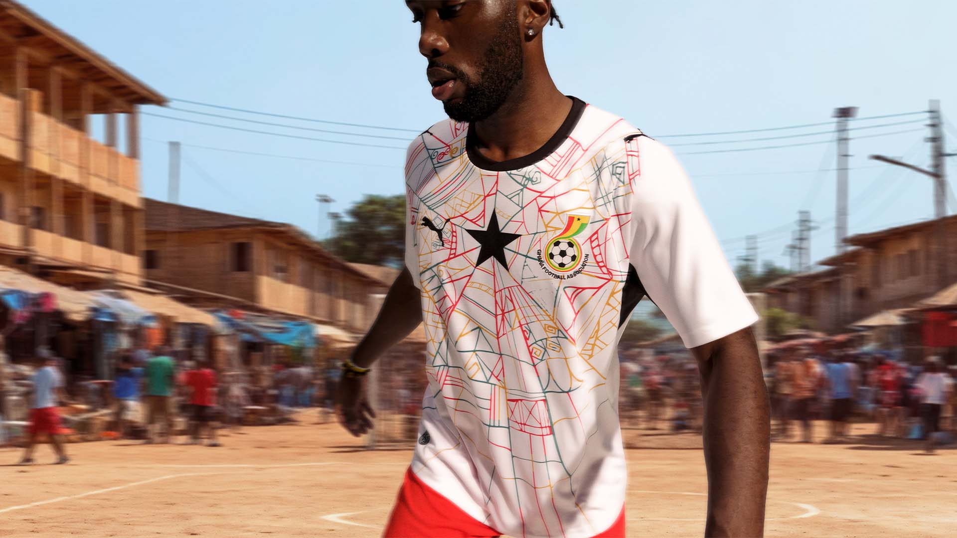 A footballer playing in Africa whilst wearing the new Ghana Puma kit that the country will wear at the 2026 World Cup