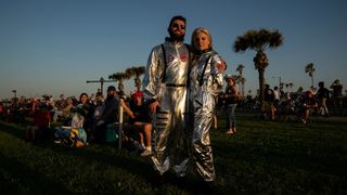 A pair of space enthusiasts awaiting the debut launch of SpaceX' Starship.