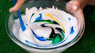 Add in your food coloring and mix. Here, we added 8 drops of blue food coloring and 2 drops of yellow food coloring for an eye-catching teal.