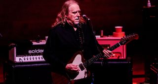 Warren Haynes of Gov't Mule plays his non-reverse Firebird onstage in Italy, with a Soldano SLO-100 tube amp in the background.