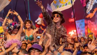 A man in the crowd at the Pyramid Stage who knows how to get Glastonbury tickets